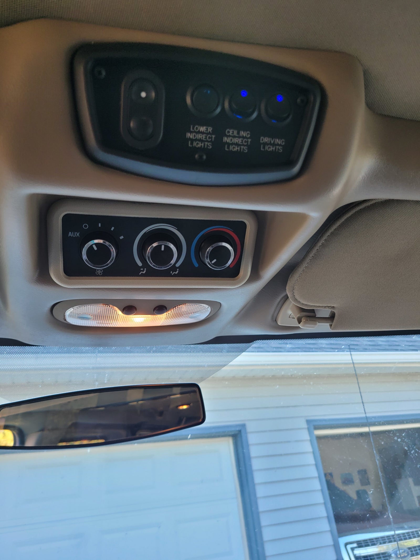 with an illuminated dome light below.|Inside an **RV rental**: dashboard features