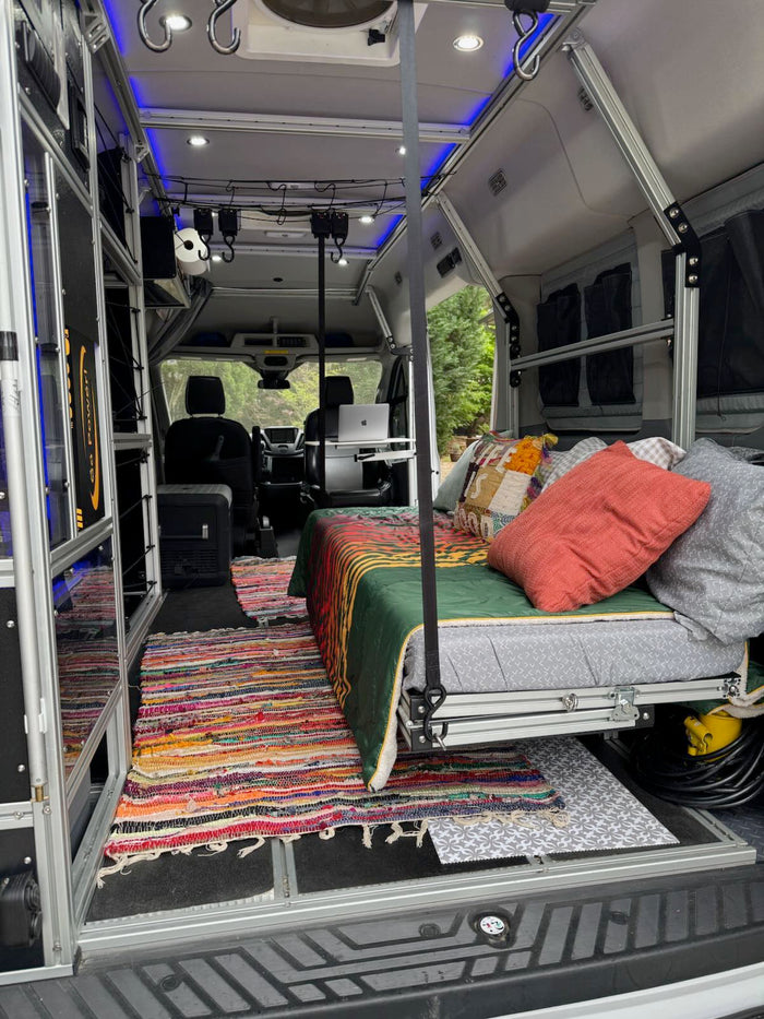perfect for mobile adventures.|Explore in this comfy RV rental! Pet-friendly van with custom storage