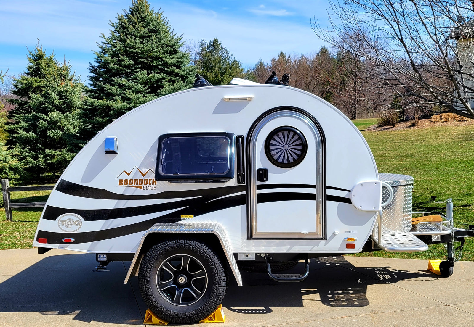 A white T@G Boondock Edge teardrop RV
