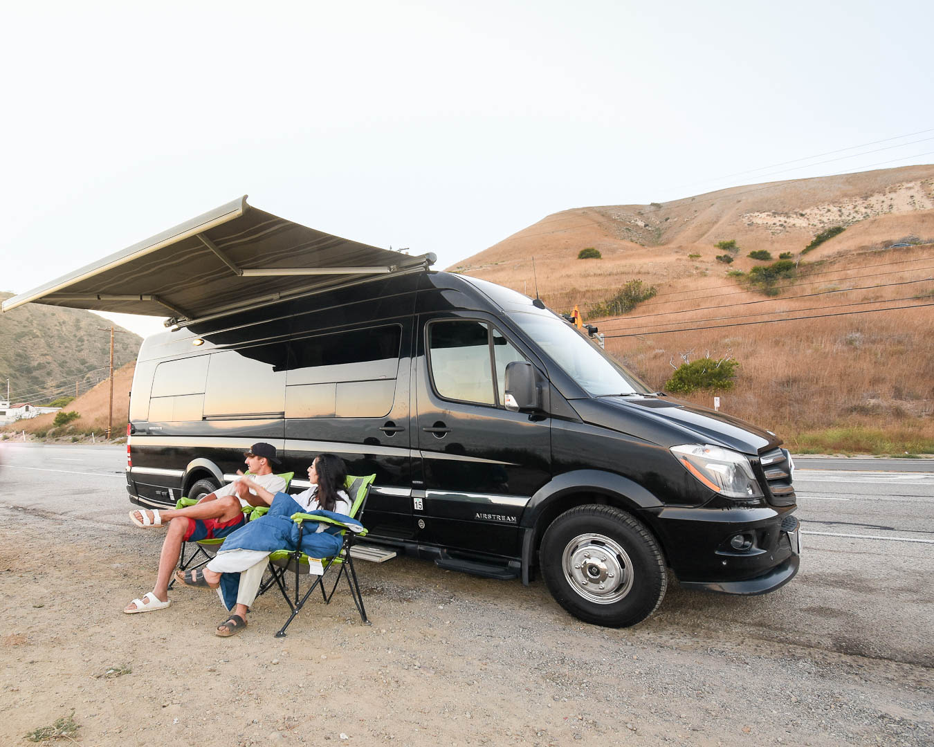 making travel cooking easy.|A black Mercedes-Benz Sprinter Airstream camper van — photo 8