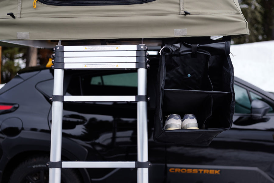 Subaru Crosstrek with rooftop tent and gear storage, perfect for an RV rental outdoor adventure.