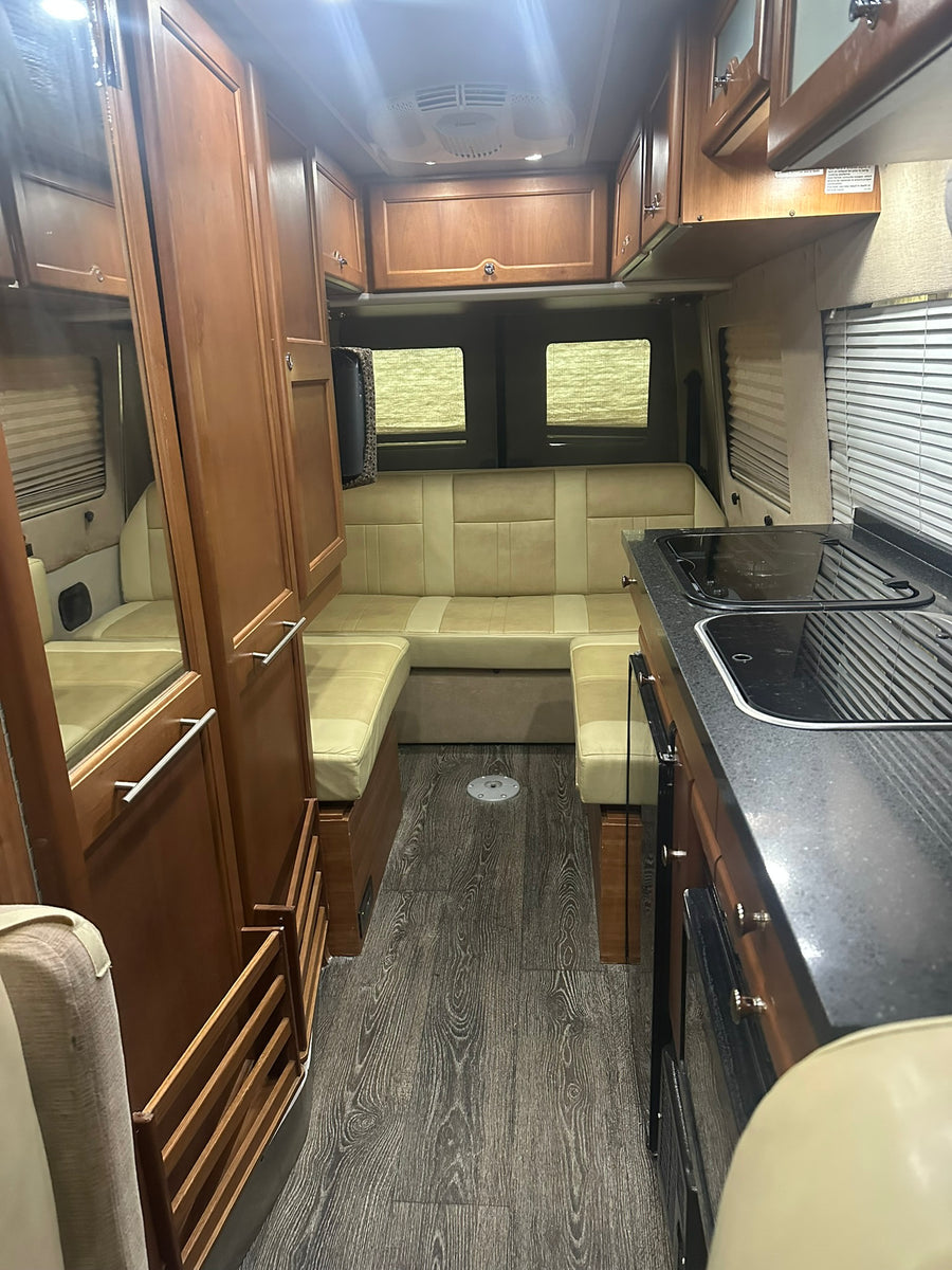 is an ideal rv rental for your next trip.|This tan Mercedes Sprinter rv rental camper van features an awning & tinted windows