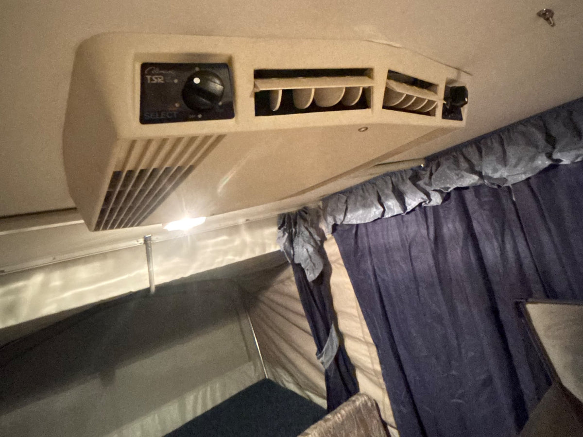" glows with purple lights at night. Perfect for travel!|Vibrant Starcraft pop-up RV rental from Laredo RV Rentals — photo 7