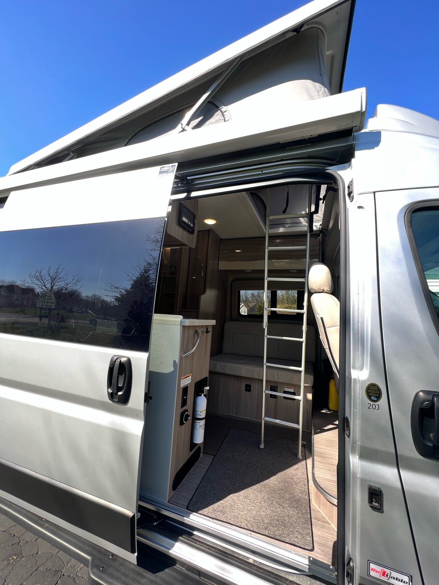 and comfortable swivel seats with an outside view.|Inside an **RV rental**: View of the dashboard