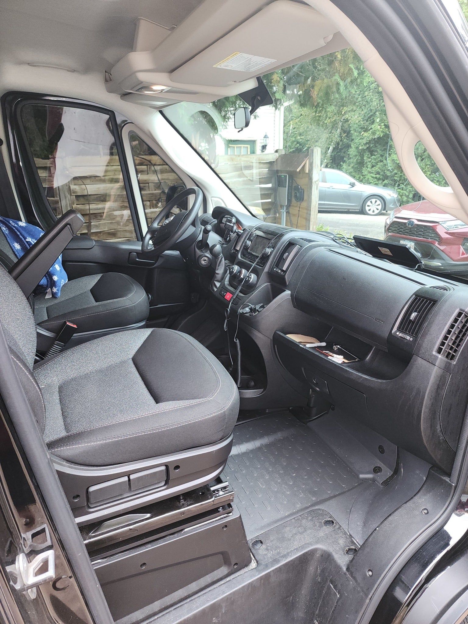 and insulated window covers.|RV rental van interior showing a bed