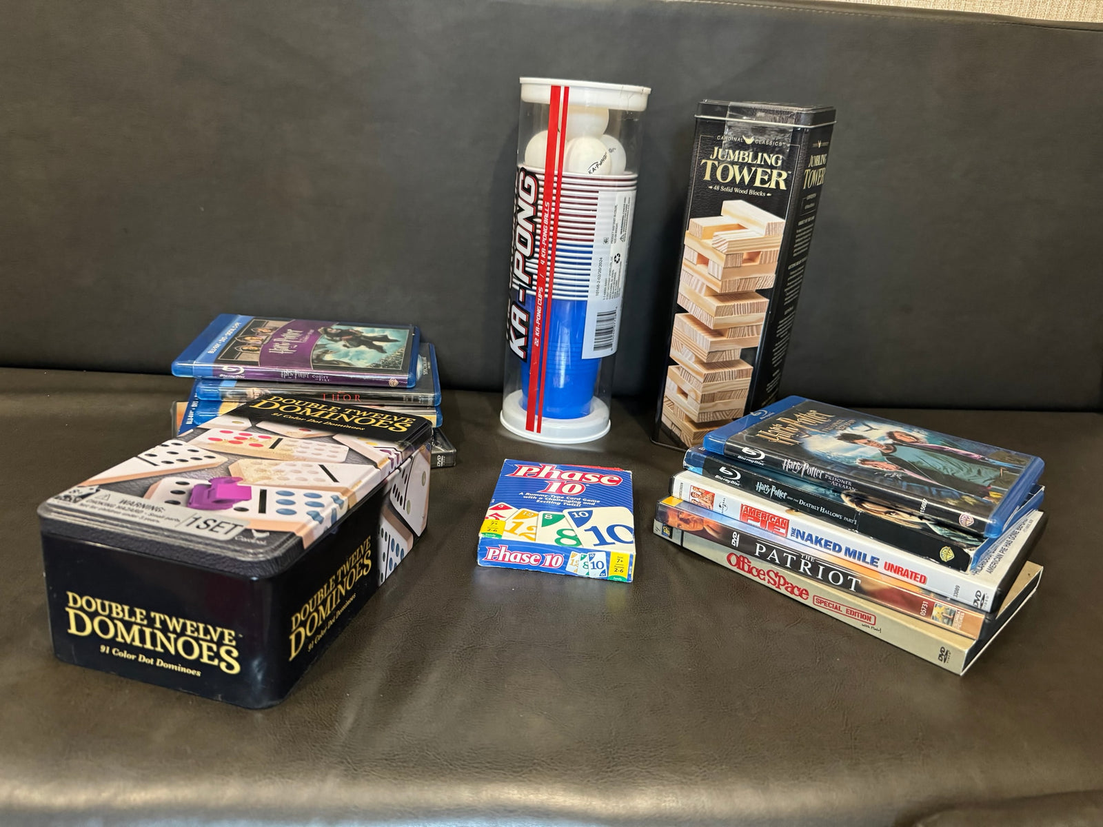 Games & movies perfect for an RV rental: Double Twelve Dominoes, Phase 10, Ka-Pong, Jumbling Tower, & Blu-rays/DVDs.