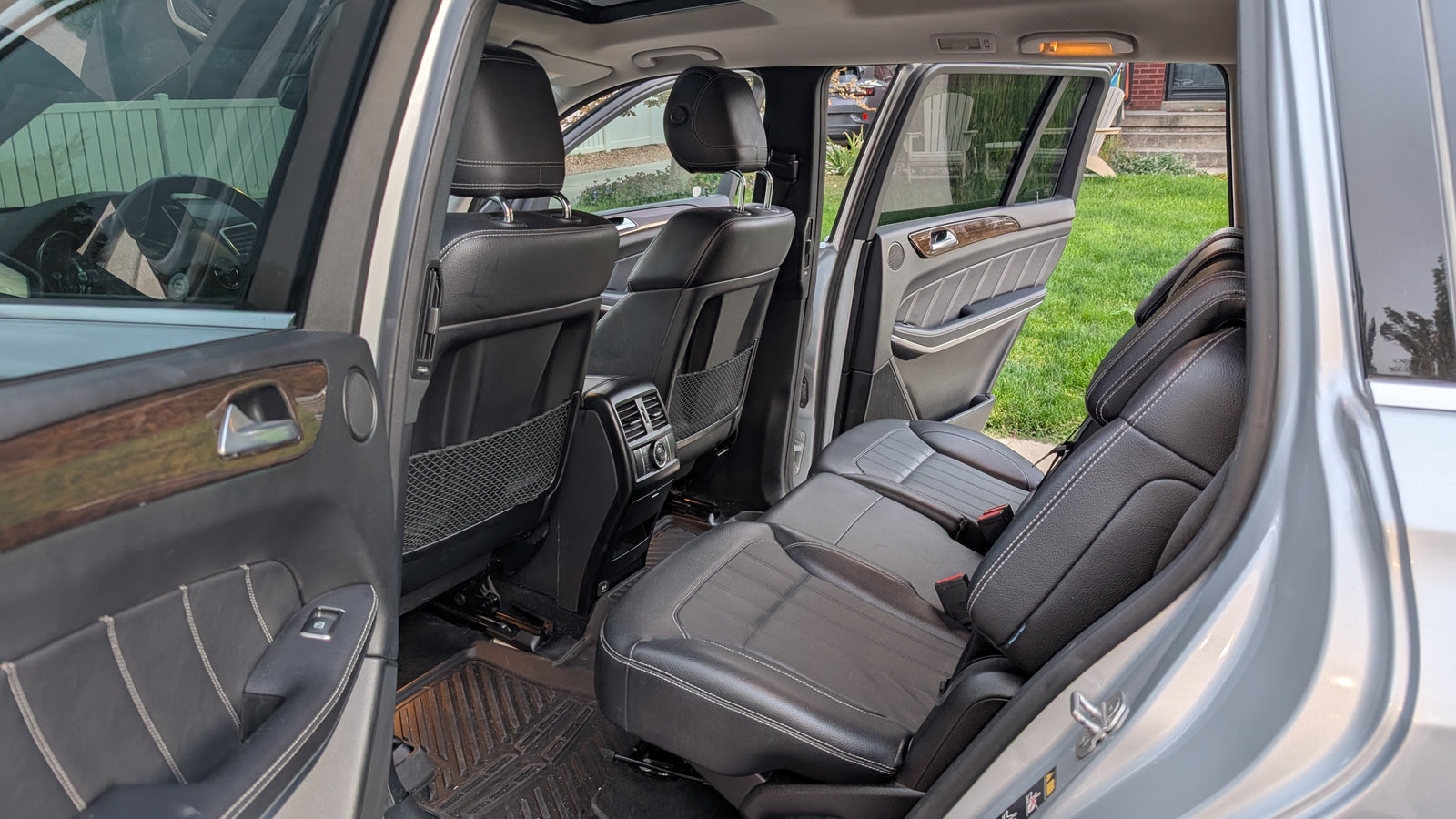 View of an SUV's spacious rear and third-row leather seats. A great option for family travel, even as an rv rental alternative.