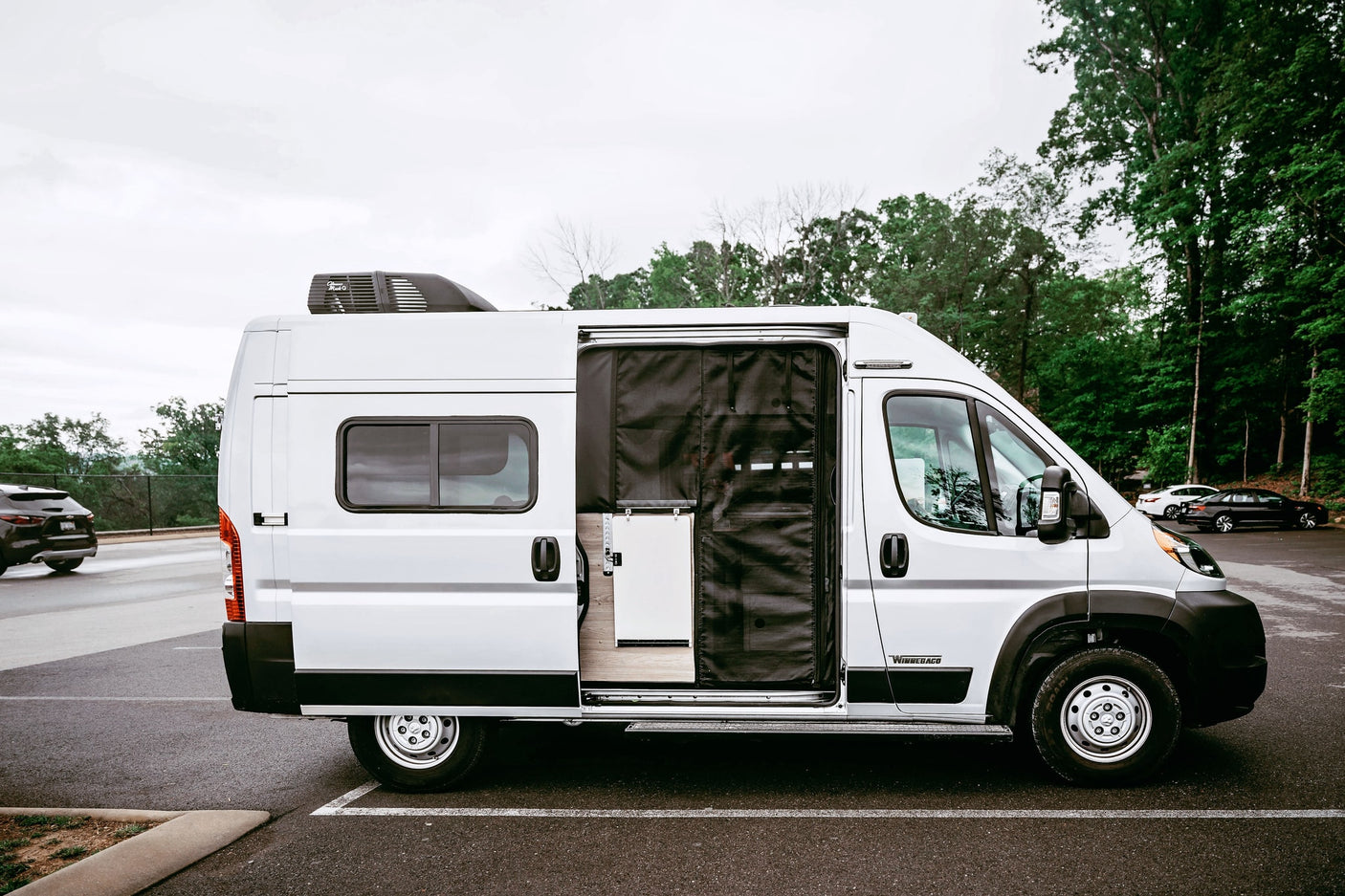 White Winnebago camper van RV rental with roof AC