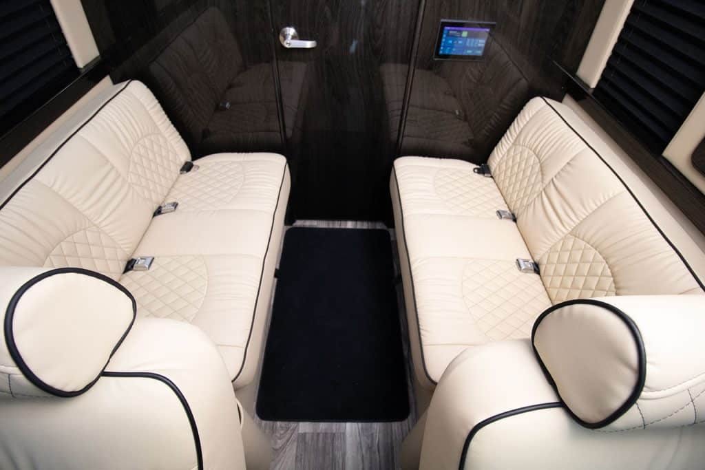 and large windows.|This luxury RV rental interior features plush captain's seats