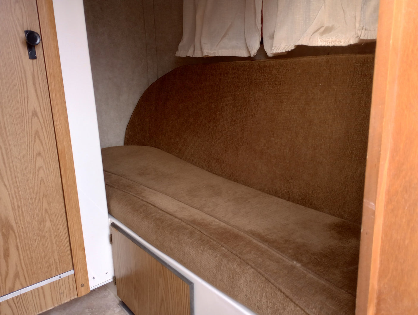 and air conditioning.|RV rental interior showcasing a compact kitchen with Dometic fridge