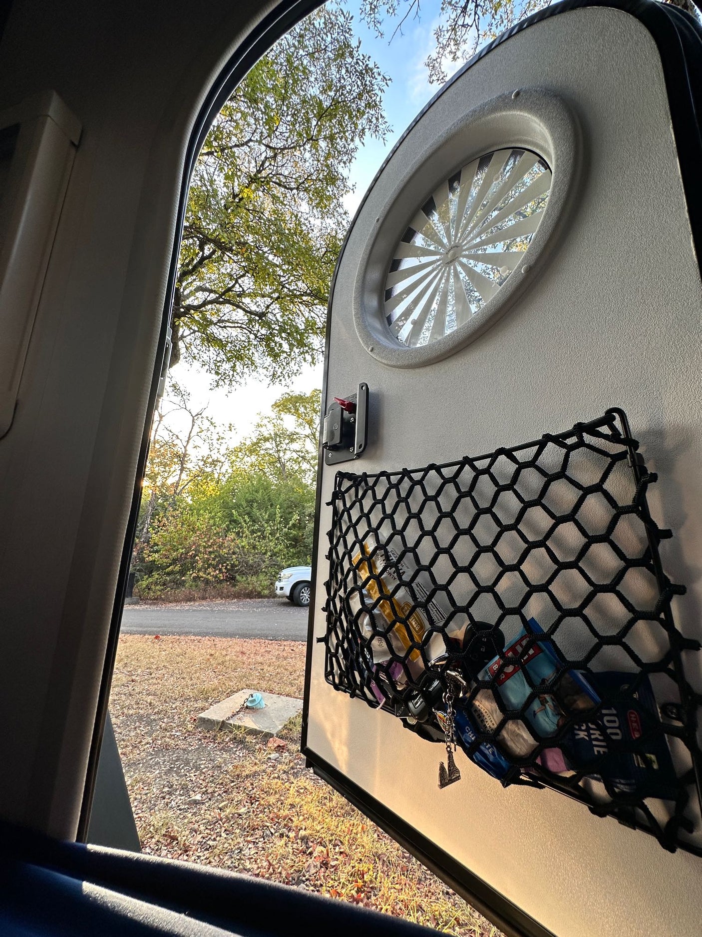 perfect for camping.|Modern RV rental bedroom featuring dark cabinetry