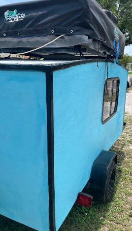 featuring a roof-top tent & spare tire