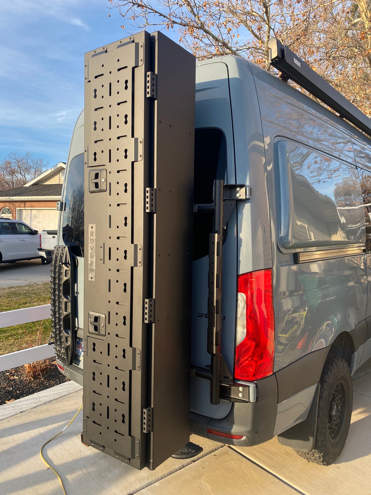 RV rental van's open modular 'ROVER' panel, recovery boards, and Thule awning offer ample gear storage for adventurers.