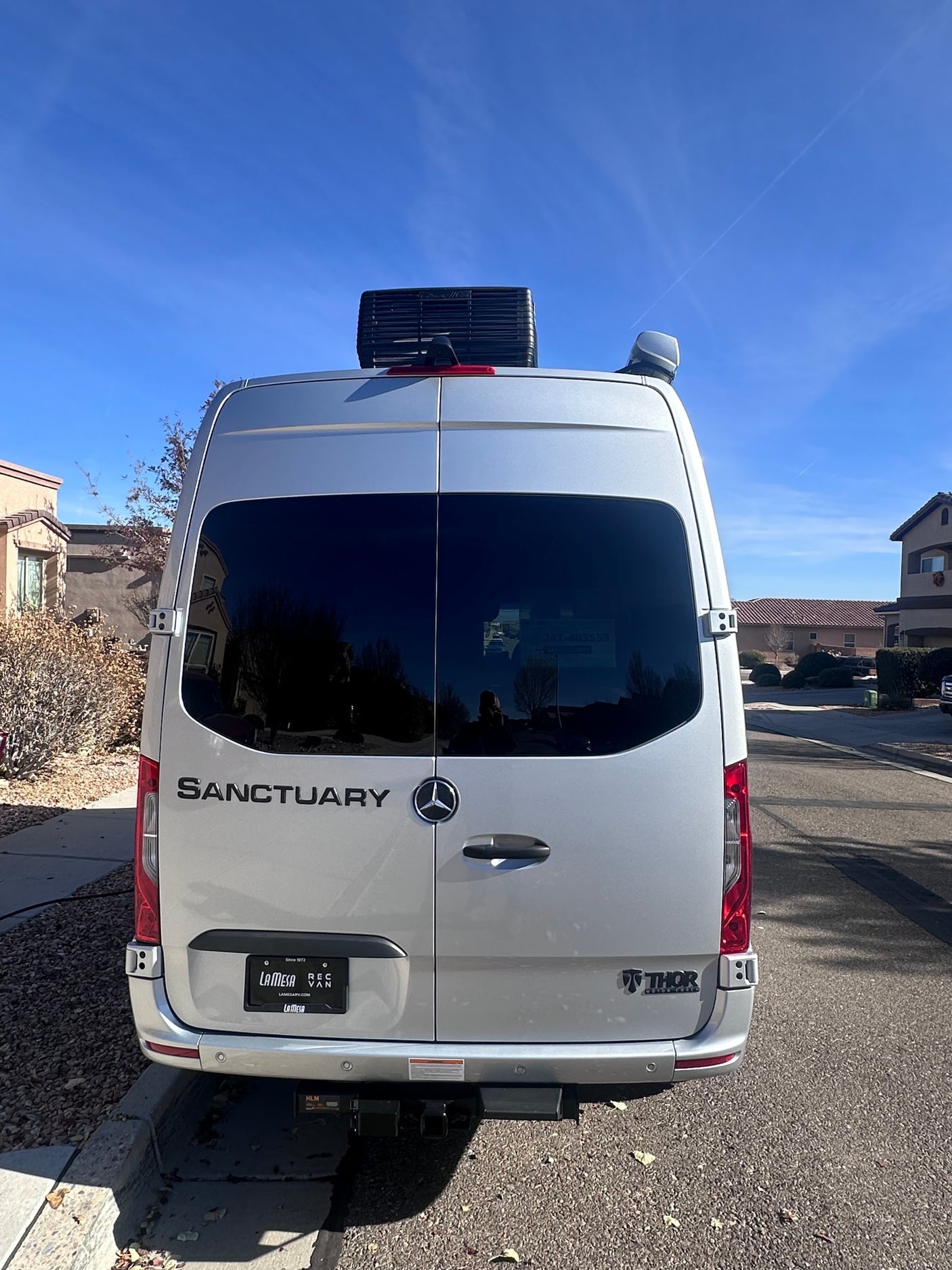 parked on a sunny residential street and plugged in