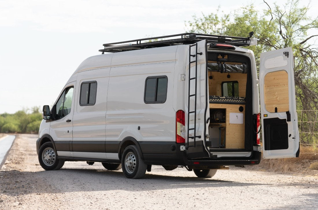 revealing a cozy wood interior.|Explore this modern RV rental's cozy
