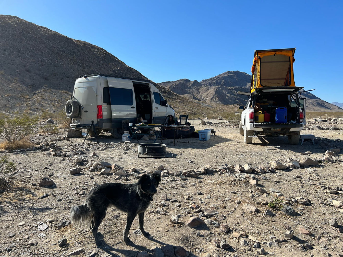 featuring off-road tires and a custom design.|Remote camping scene featuring an RV rental van — photo 3