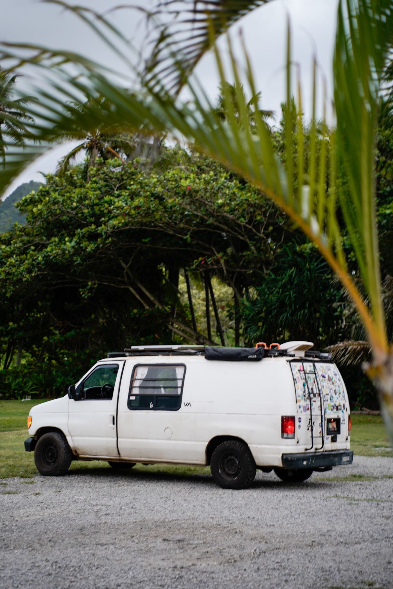 and dish soap dispensers.|This RV rental makes outdoor showers easy! Happy surfer washes off by her van