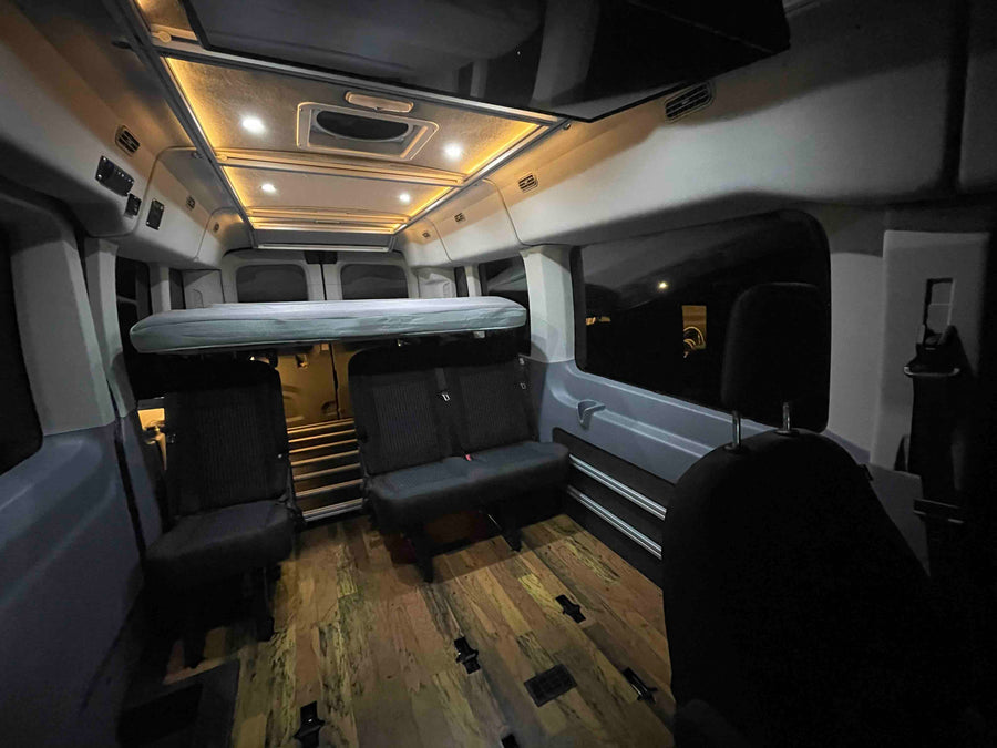 and attractive wood floor.|Customized RV rental interior with wood floor