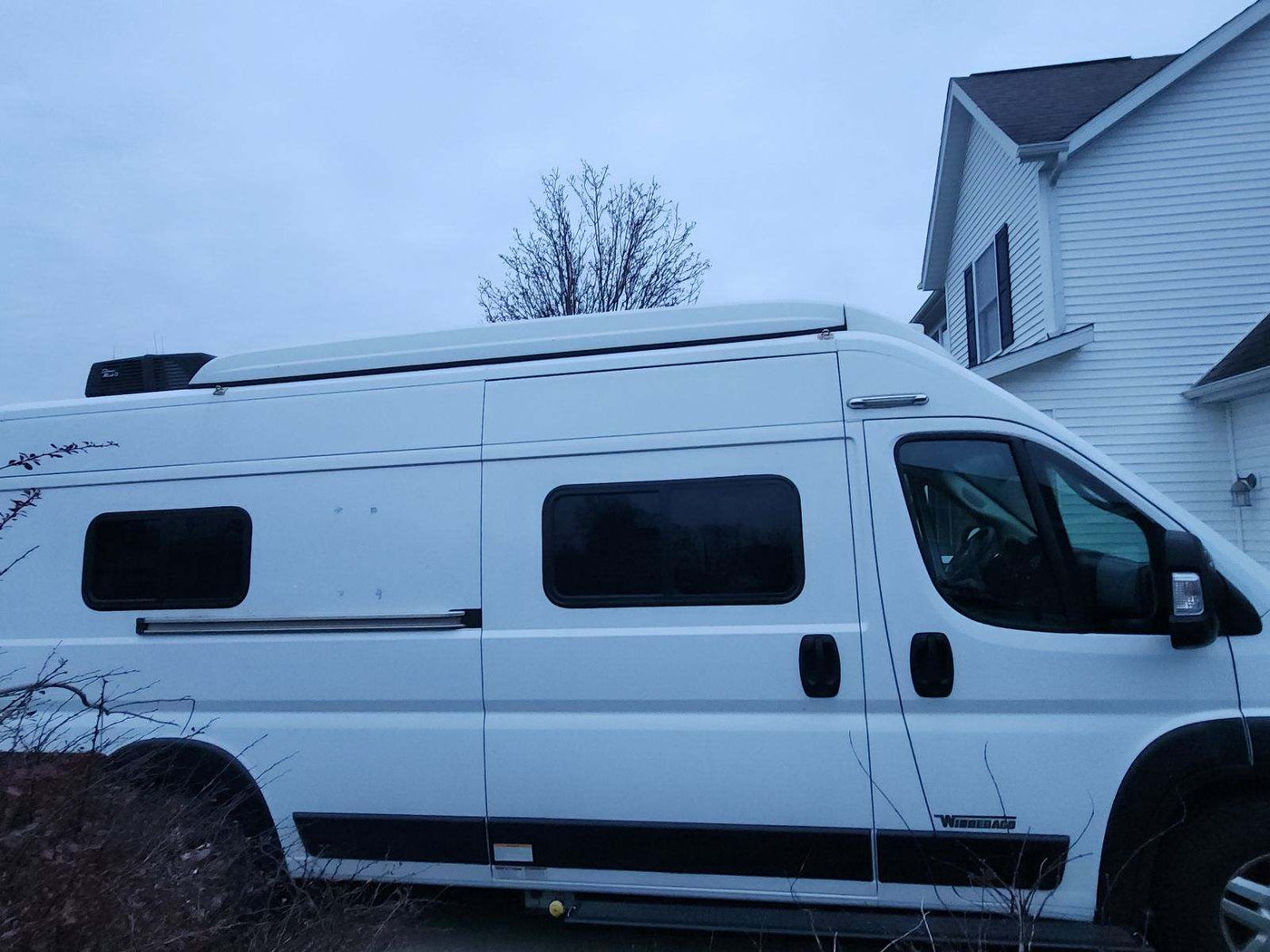 connected to shore power.|A white camper van — photo 2
