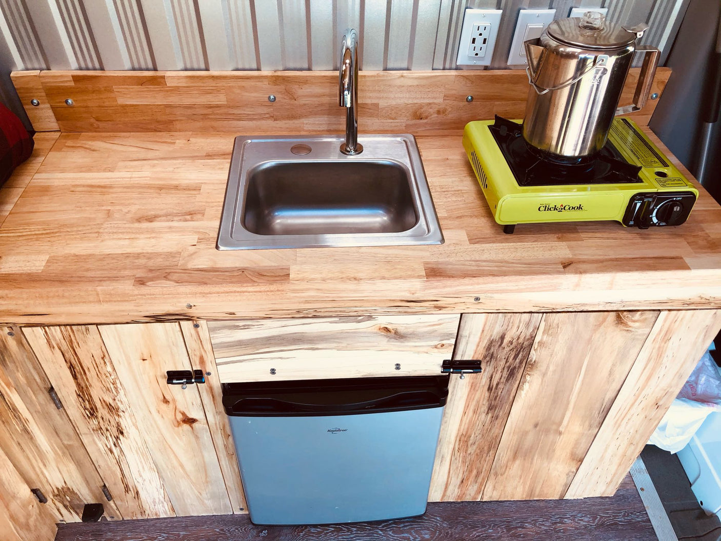 ideal for travel.|Inside an RV rental: custom wood interior