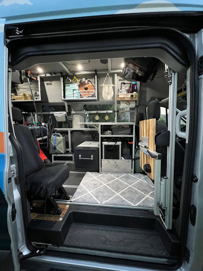 parked by a lake at sunset. Ideal for scenic outdoor adventures.|This RV rental offers a well-appointed