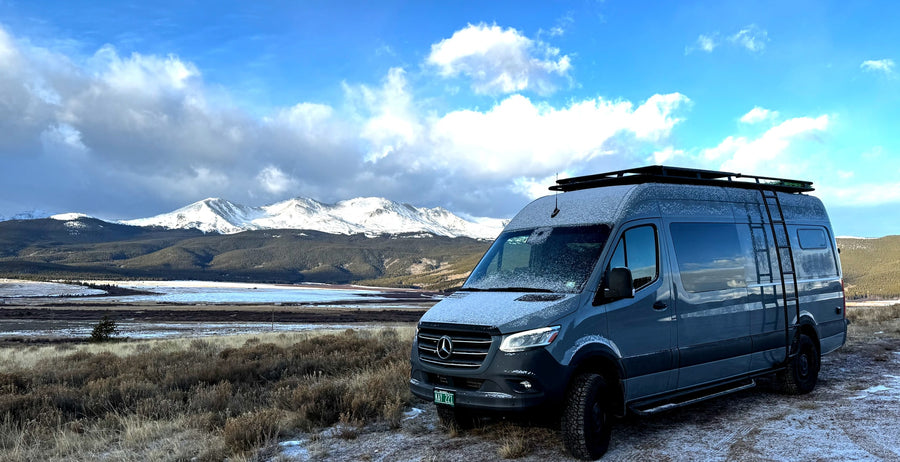 This stunning Mercedes Sprinter rv rental is ready for adventure in a snowy mountain landscape