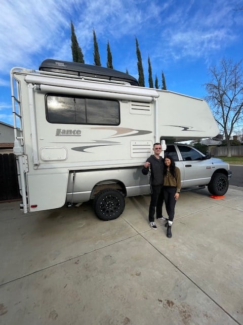 next to a carpeted floor and ceiling light.|Explore this well-equipped RV rental interior: kitchen — photo 19