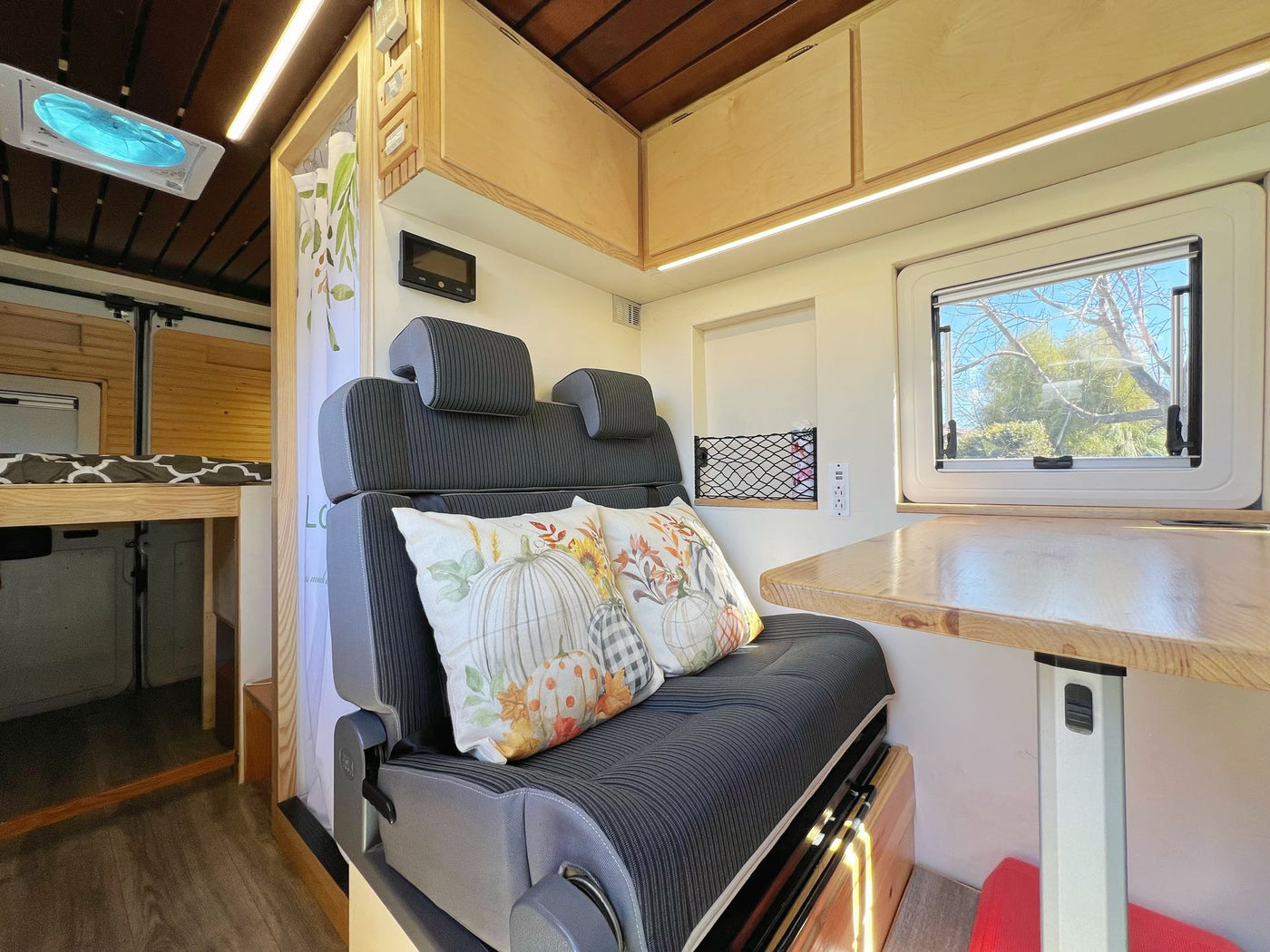 a custom camper van with illuminated wood interior — photo 8