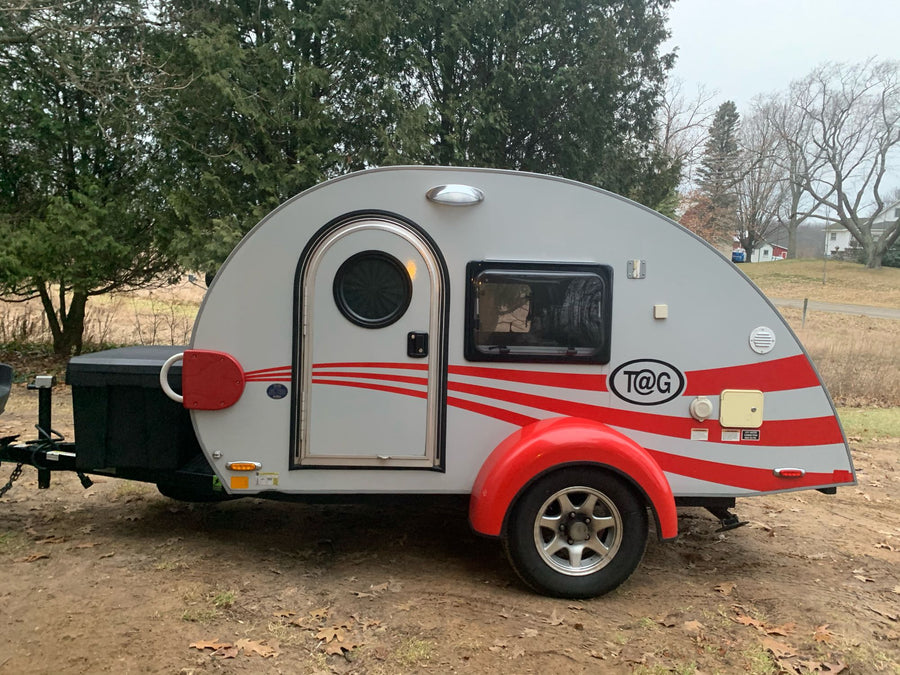 ideal for camping.|Interior of a compact RV rental bedroom