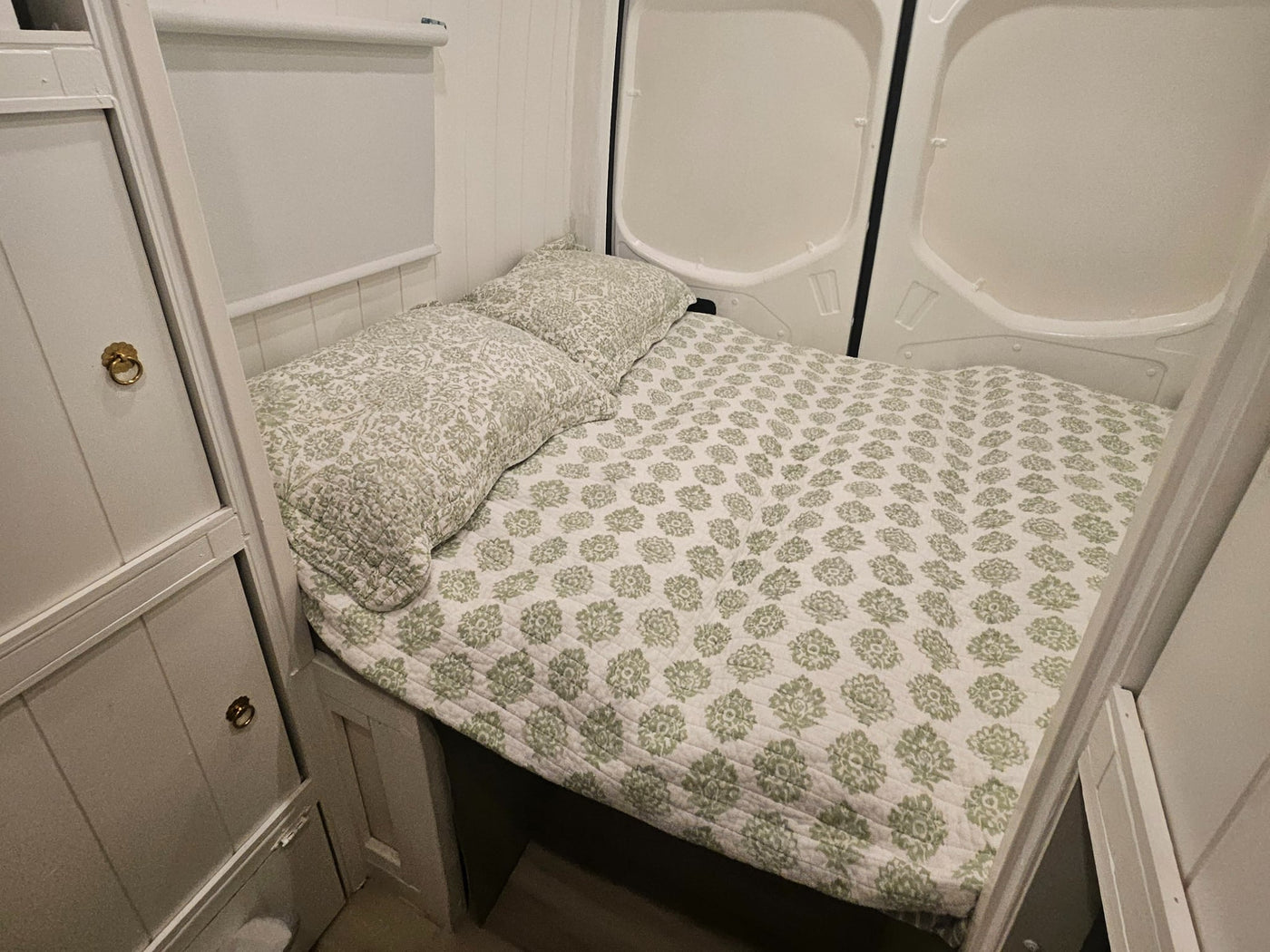 and light-colored flooring.|RV rental van interior showing a full kitchenette (microwave — photo 5