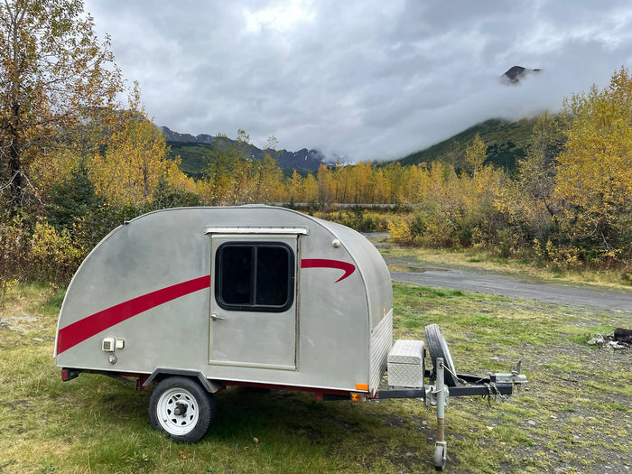 ideal for nature adventures.|Cozy rv rental sleeping nook with wood-paneled walls