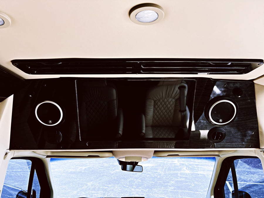 and horizontal blinds for luxurious travel.|Spacious luxury RV rental interior with four plush