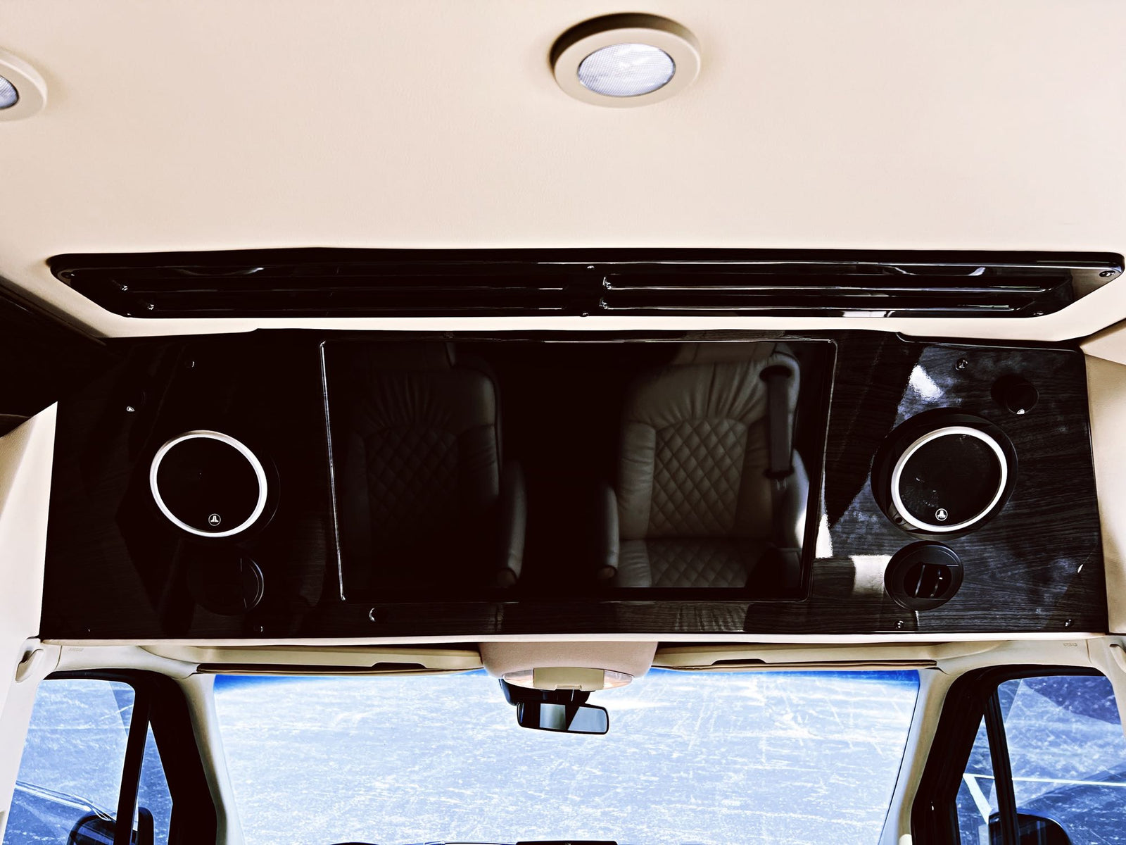 and horizontal blinds for luxurious travel.|Spacious luxury RV rental interior with four plush