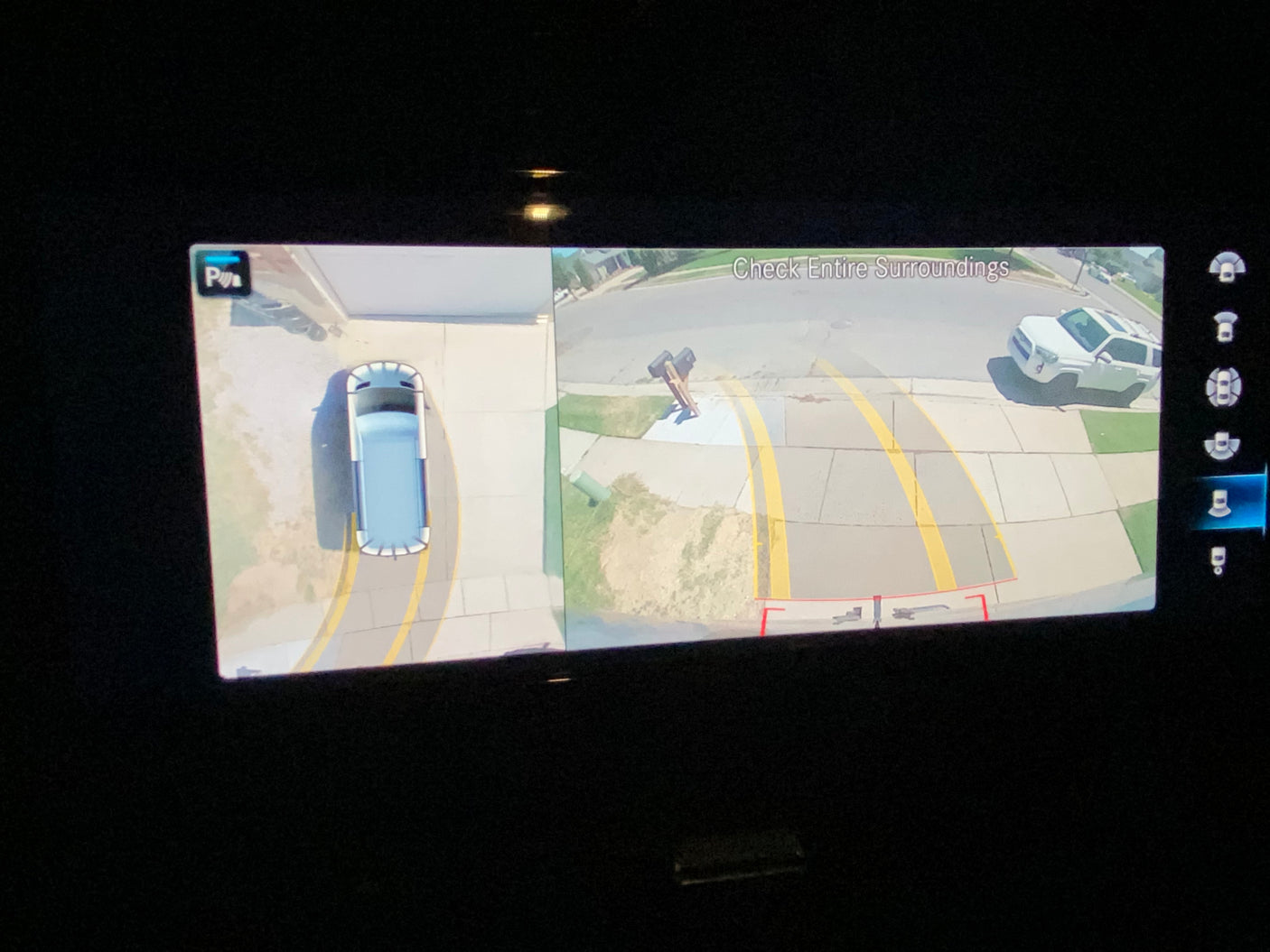 360-degree camera display for an RV rental, showing overhead view of the van, street, and a white SUV.