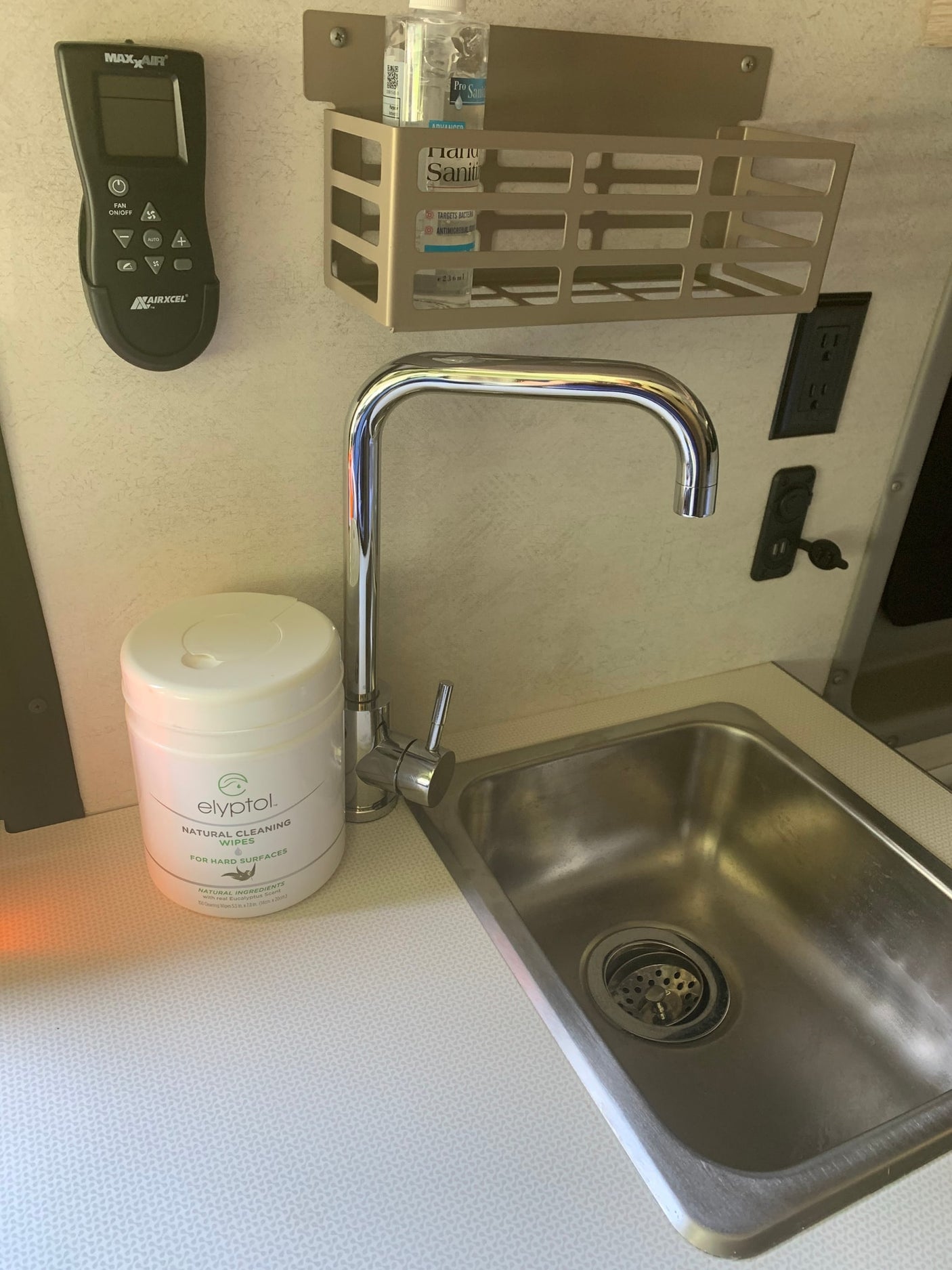 and drink koozies for travel essentials.|Empty and clean interior of an RV rental refrigerator