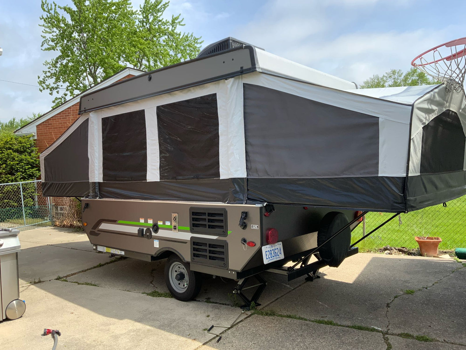 ready for travel.|Interior of a compact pop-up RV rental