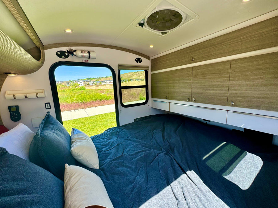Cozy rv rental interior with a comfy bed