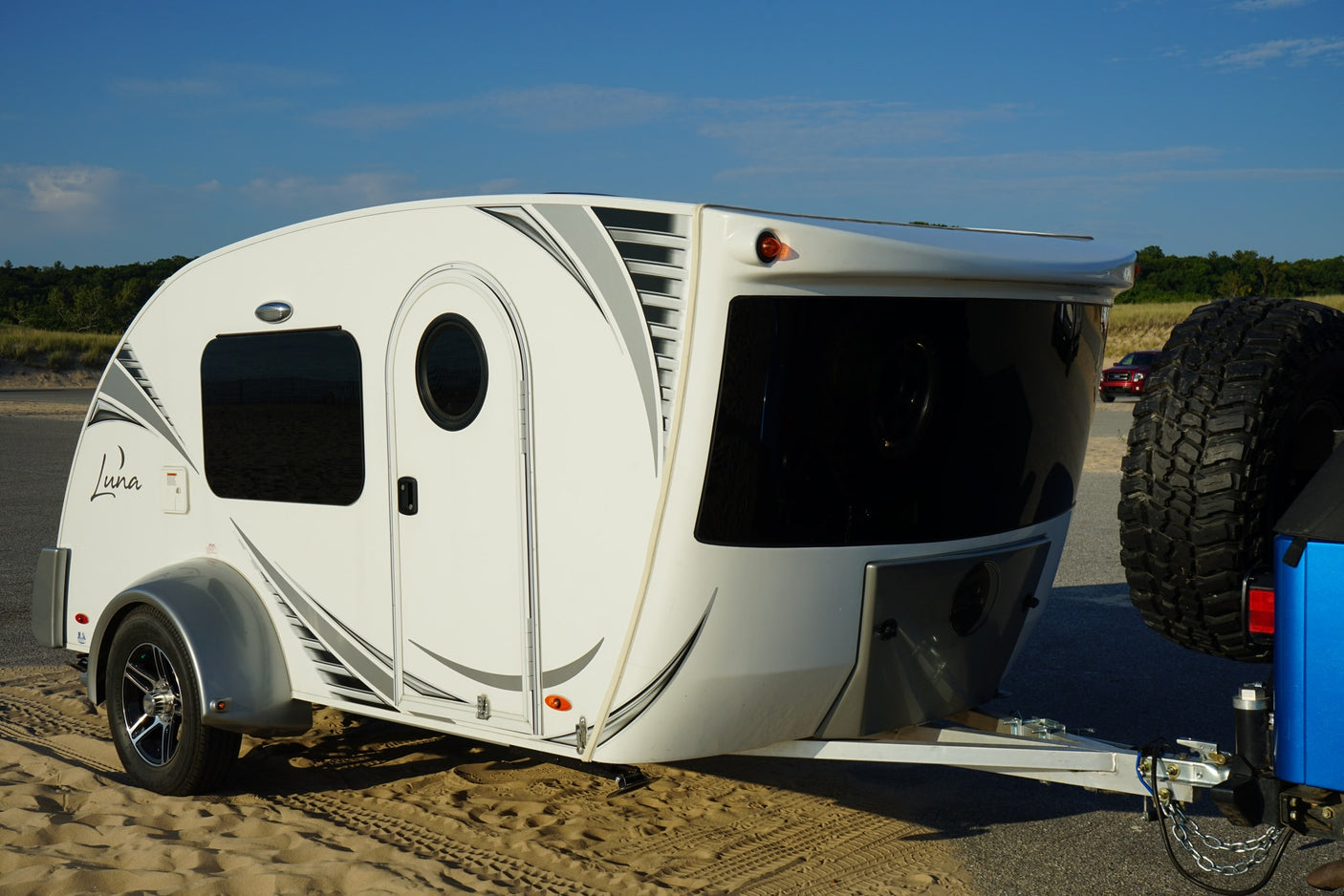 and ocean with a distant pier. Coastal adventure awaits!|RV rental outdoor kitchen with sink