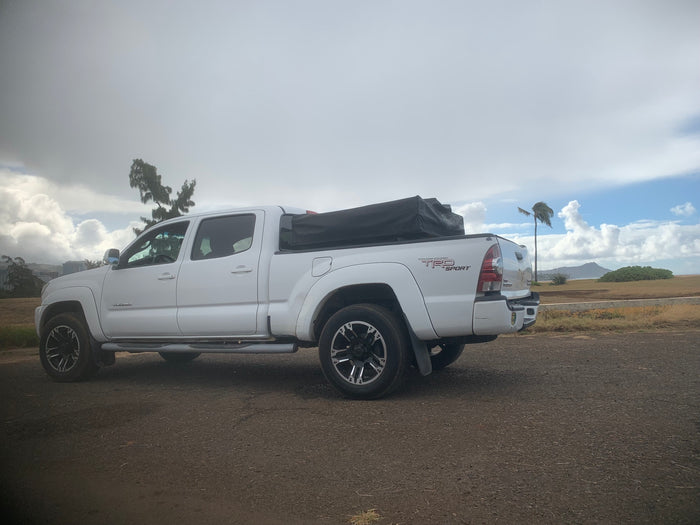 and table by the coast. Experience the outdoors with an rv rental adventure!|White Toyota Tacoma pickup