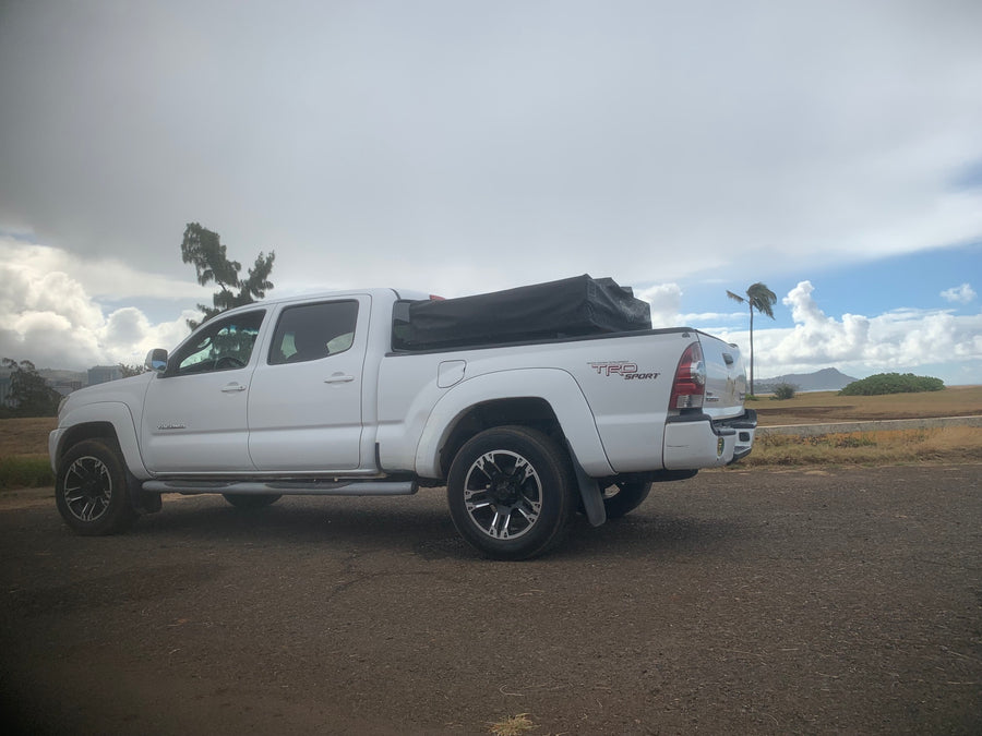 and table by the coast. Experience the outdoors with an rv rental adventure!|White Toyota Tacoma pickup