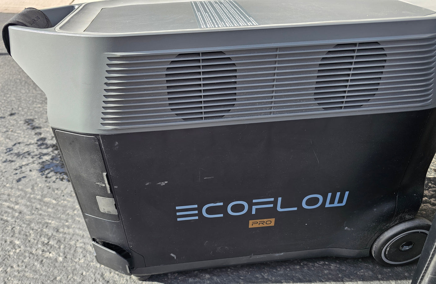 EcoFlow Pro portable power station for rv rental, a dark grey/black unit with wheels and vents, ready for off-grid power.