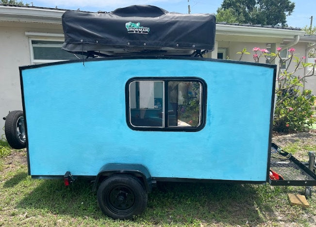 featuring an AC unit and rooftop tent