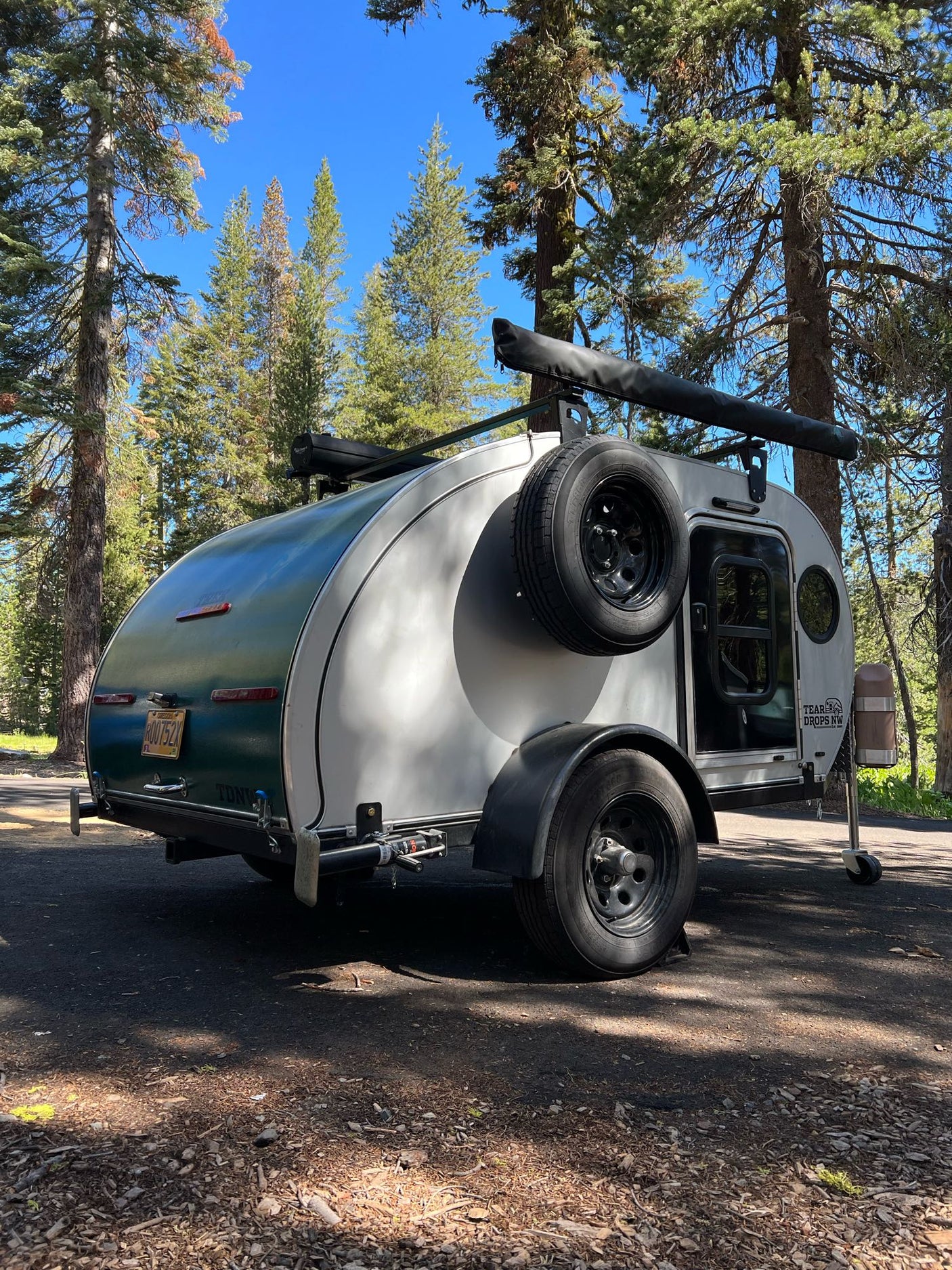 ready for adventure camping.|A white Mercedes van tows a compact