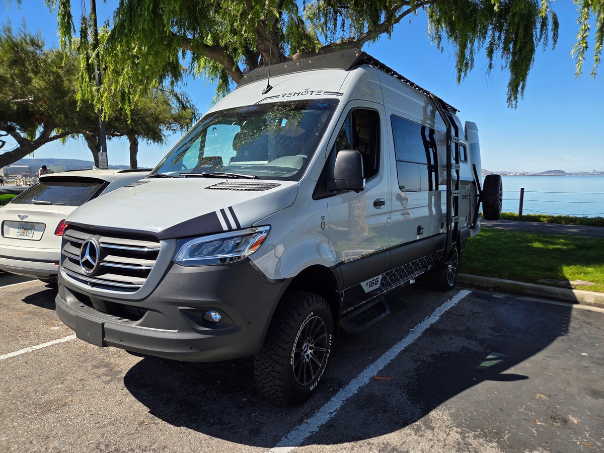 and a rear spare tire.|Custom gray Mercedes Sprinter RV rental van — photo 10