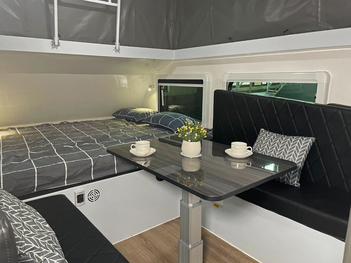 set for travel.|Modern RV rental interior with dining benches