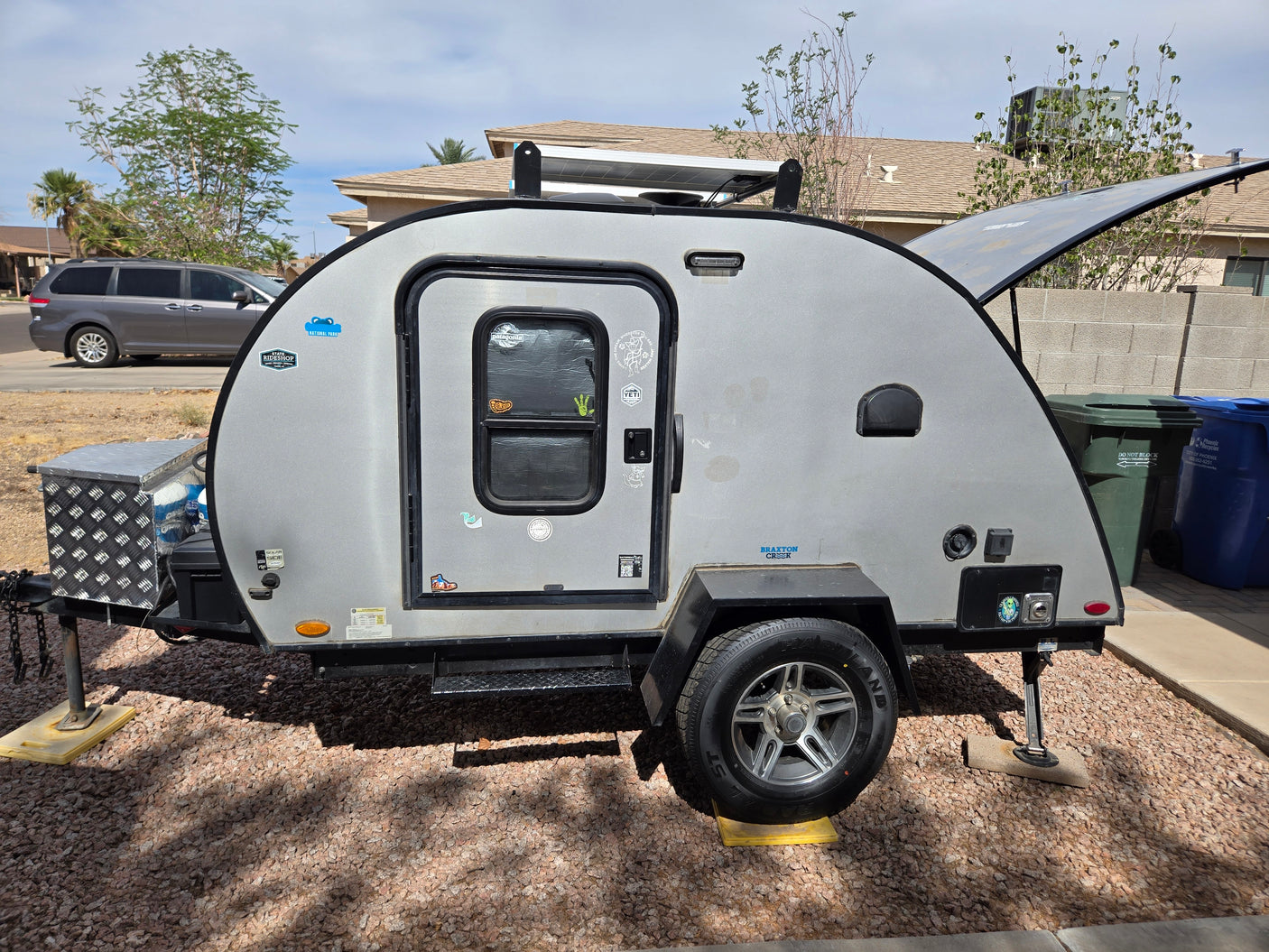 This Braxton Creek teardrop camper, perfect as an rv rental, features solar panels for your next outdoor adventure.