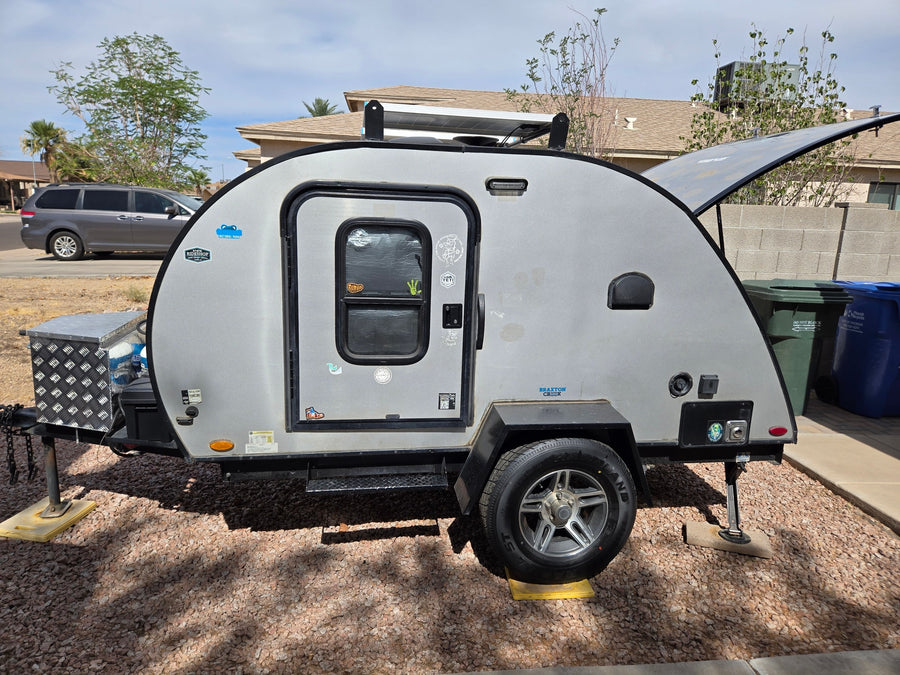 This Braxton Creek teardrop camper, perfect as an rv rental, features solar panels for your next outdoor adventure.
