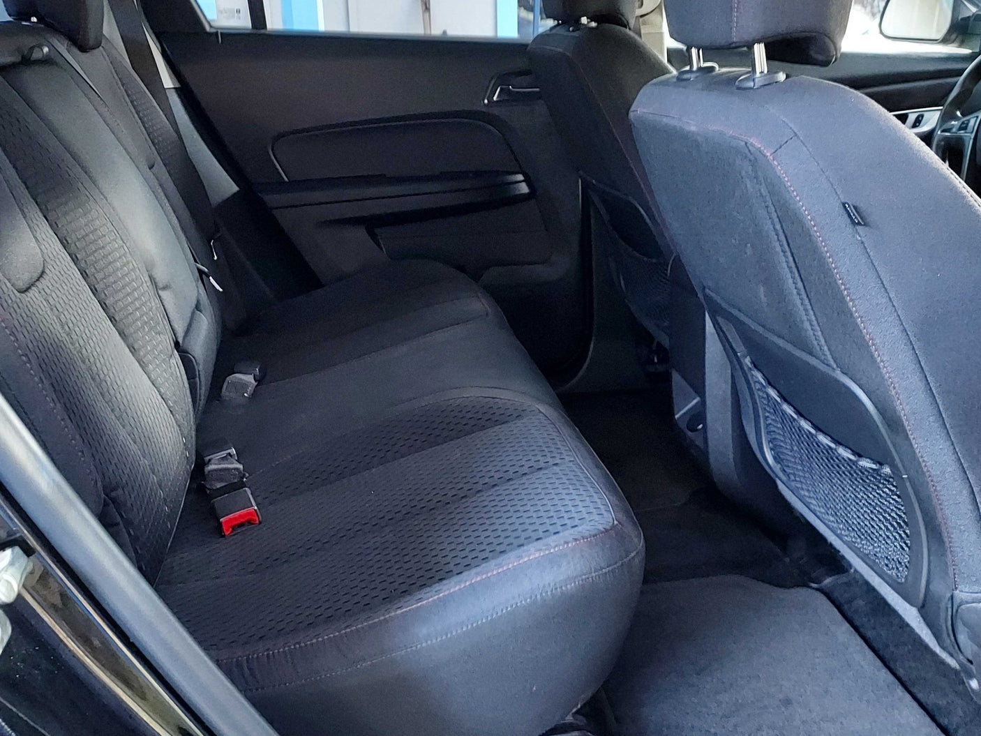 Rear vehicle interior featuring clean, comfortable back seats and seatbelts, ready for your RV rental road trip.