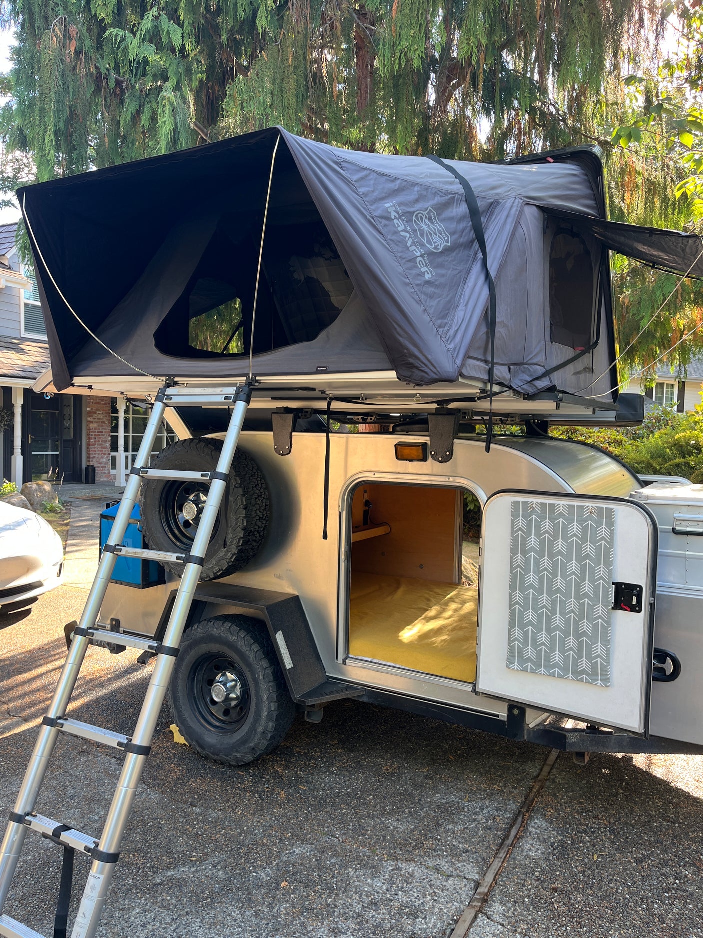 Explore the outdoors with this unique rv rental: a teardrop trailer featuring an iKamper rooftop tent. Ideal for camping!