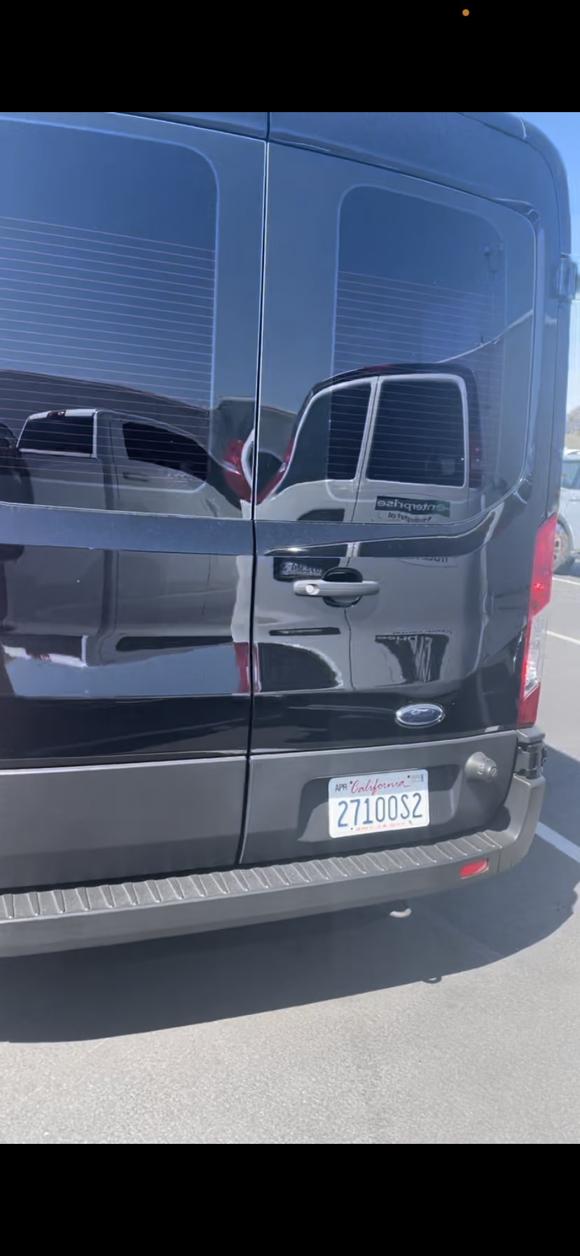 perfect for travel.|Black Ford Transit van for RV rental